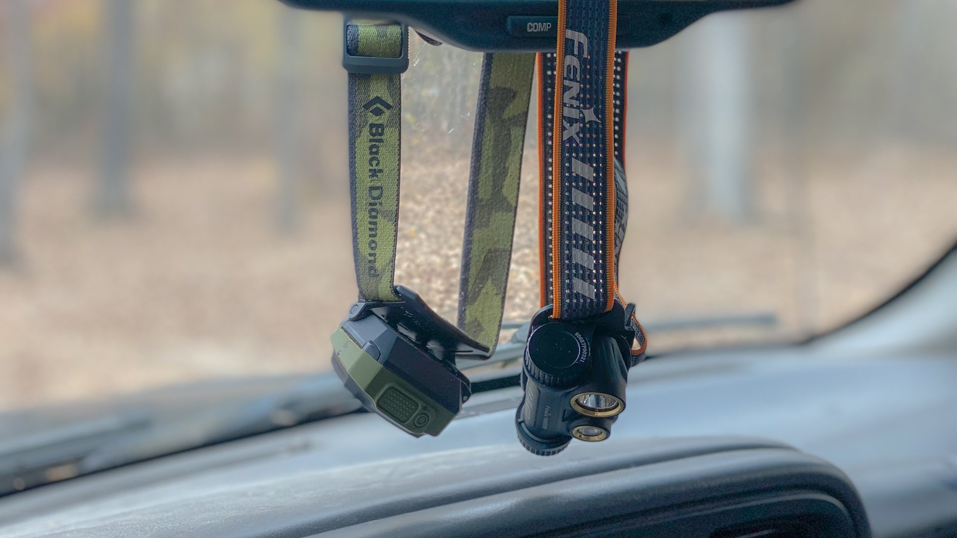 two headlamps hanging from rearview mirror